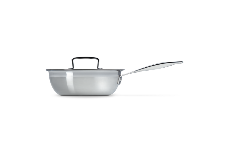 Le Creuset 3-ply 20cm chefs pan in stainless steel with lid and long handle, side view.