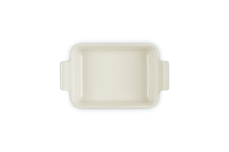 Le Creuset Stoneware Heritage rectangular dish in Sea Salt, top view showing handles and smooth interior.