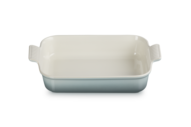 Le Creuset Stoneware Heritage rectangular dish in sea salt with handles, shown empty from above.