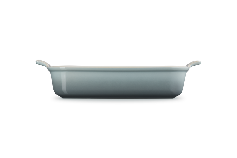 Le Creuset Stoneware Heritage rectangular dish in sea salt, side view showing handles and depth.