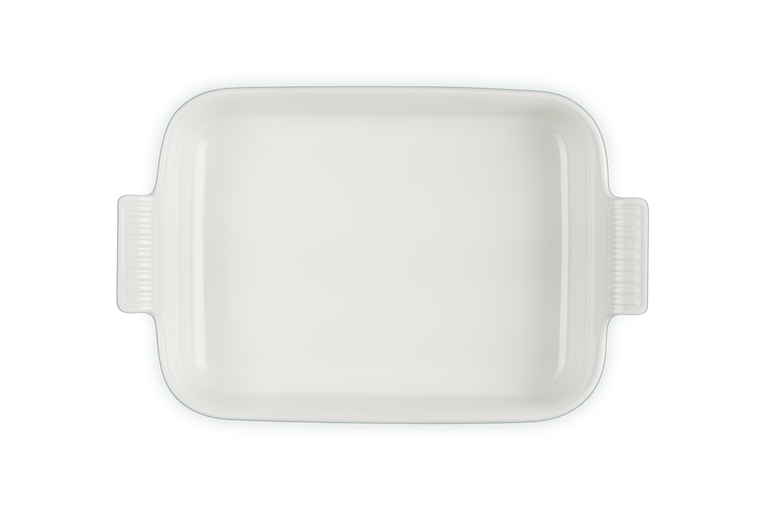 Le Creuset Stoneware Heritage rectangular dish in sea salt, top view showing handles and smooth interior.