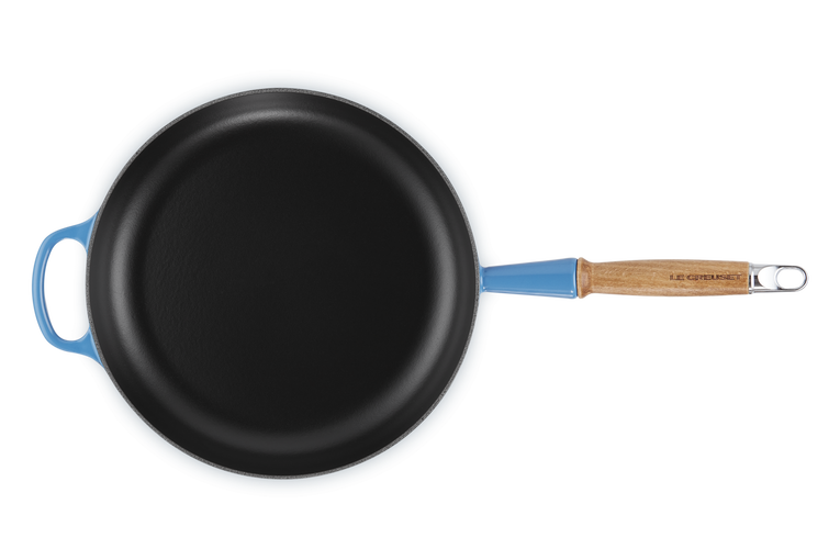 Le Creuset 28cm Azure cast iron frying pan with wooden handle, top-down view on white background