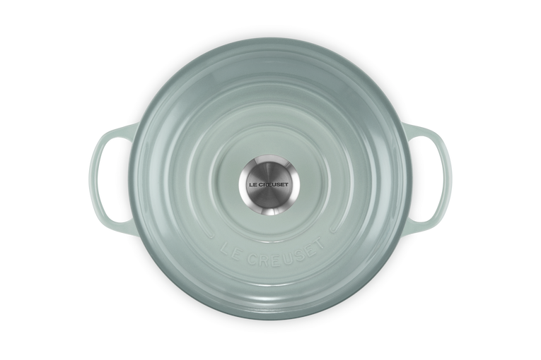 Top view of Le Creuset Signature Cast Iron Shallow Casserole 26cm in Sea Salt with lid and handles visible.