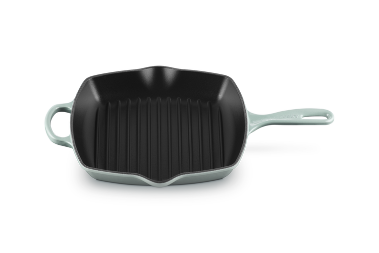 Le Creuset 26cm Square Grillit pan in Sea Salt with ridged black cooking surface and long handle.