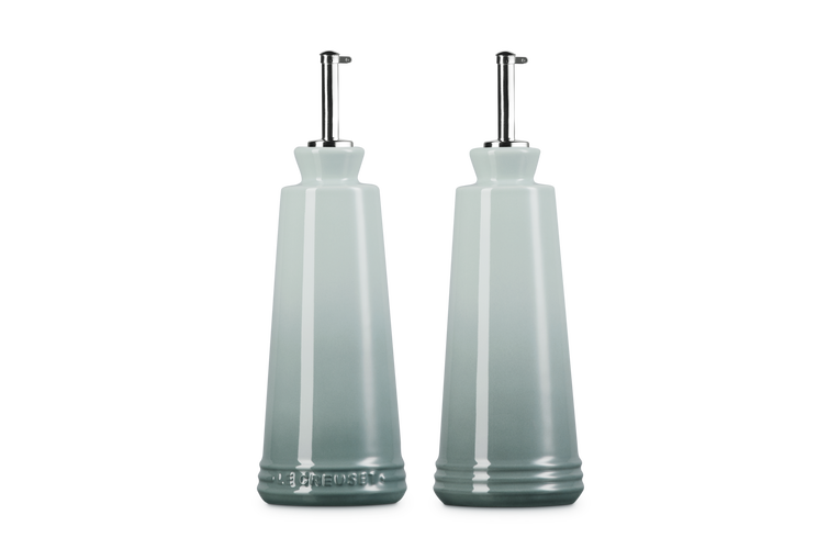 Le Creuset 330ml stoneware oil and vinegar set in sea salt blue with stainless steel pour spouts.