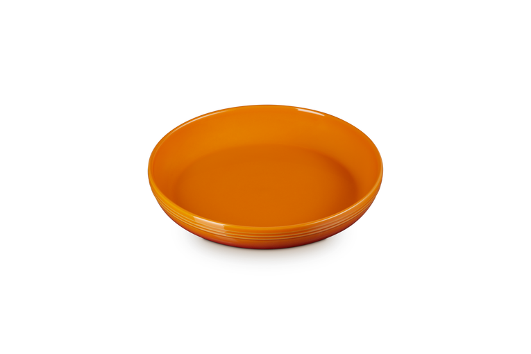 Le Creuset Coupe Pasta Bowl in volcanic orange, shown from a slightly angled top view on a white background.