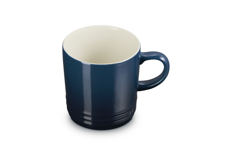 Le Creuset London Mug 350ml in deep blue with a cream interior, shown from a top angle.