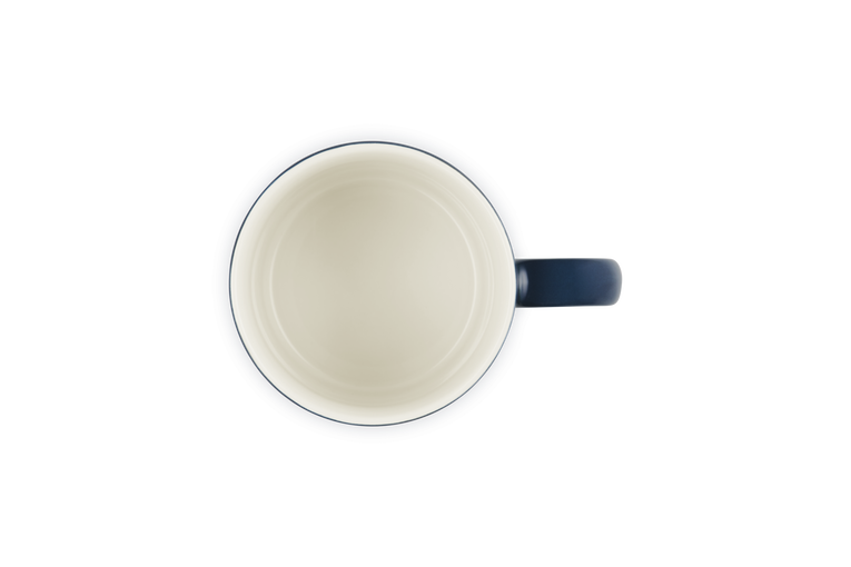 Le Creuset London Mug 350ml Nuit shown from above, with a dark blue handle and cream interior.