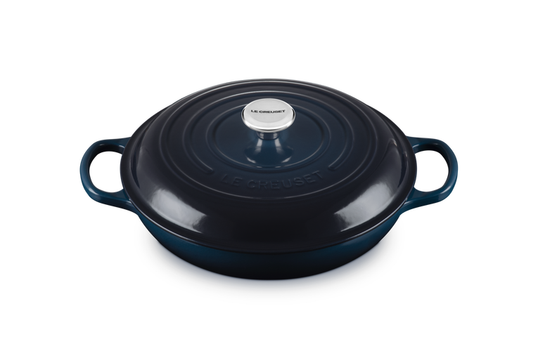 Le Creuset 30cm shallow cast iron casserole in Nuit blue with lid and side handles, top view.