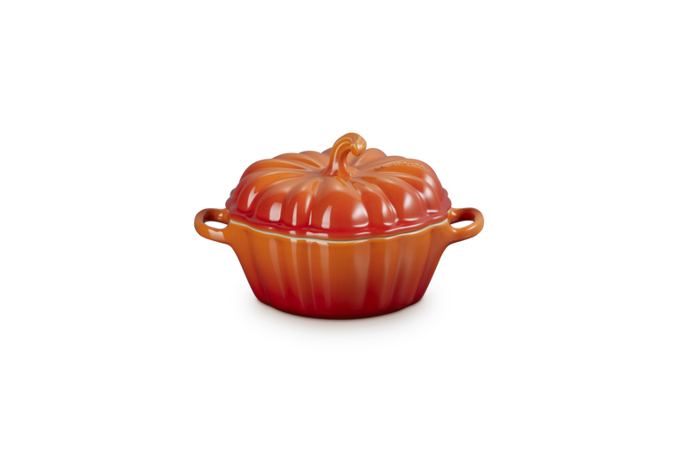 Le Creuset Halloween pumpkin-shaped casserole dish in volcanic orange with lid and side handles, 350ml capacity.