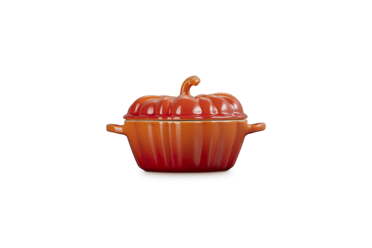 Le Creuset Halloween pumpkin-shaped volcanic orange casserole dish with lid, 350ml capacity, side view.