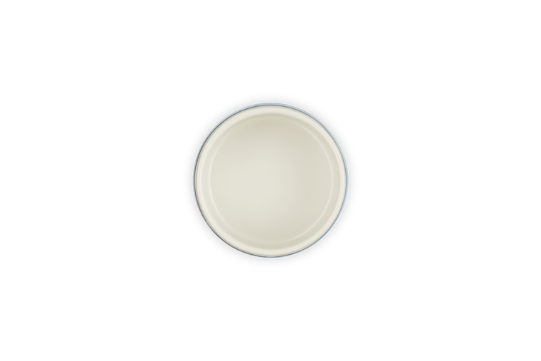 Top view of a cream-colored Le Creuset Ramekin 8cm Nuit with a dark outer rim.
