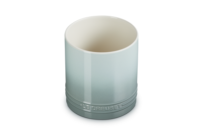 Le Creuset small utensil jar in sea salt color with a smooth gradient and embossed logo near the base.