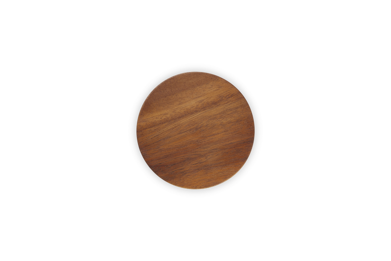 Top view of Le Creuset Stoneware Storage Jar lid in natural wood finish against black background.