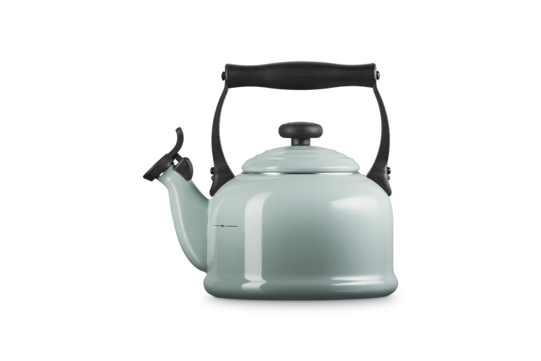 Le Creuset 2.1L Traditional Kettle in sea salt color with black handle and spout cover, side view.