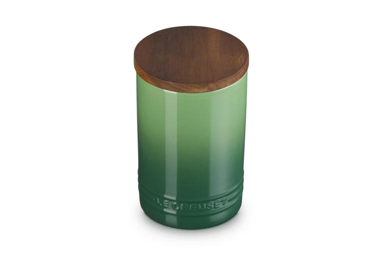 Le Creuset stoneware storage jar in green gradient with a round bamboo lid, 770ml capacity.
