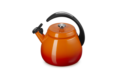Le Creuset Cloche Kettle 2.1L in Volcanic orange with black handle and spout cover, front angle view.