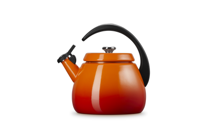 Le Creuset Cloche Kettle 2.1L in volcanic orange with black handle and spout cover, front view.