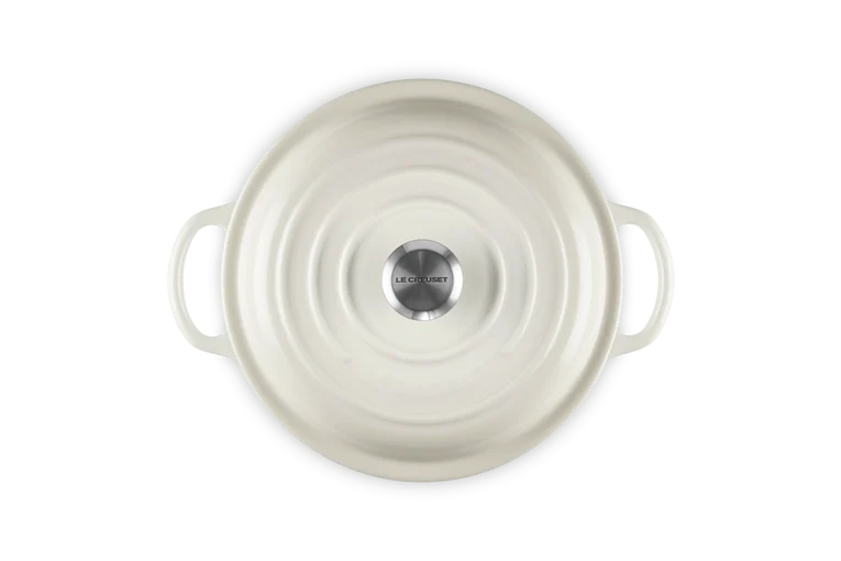 Signature Round Stew Pot 22cm in meringue, top view showing lid with stainless steel knob and side handles.