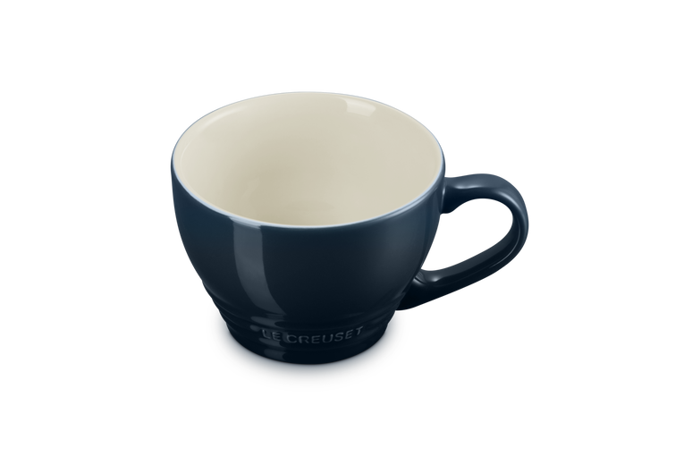 Le Creuset Grand Mug Nuit in dark blue with cream interior, shown at a slight angle with handle visible.