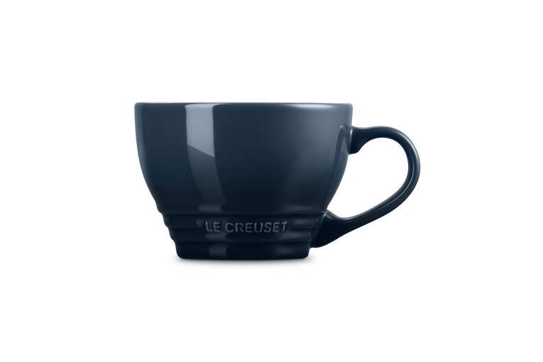 Le Creuset Grand Mug Nuit in dark blue with a rounded handle and embossed logo on the base.