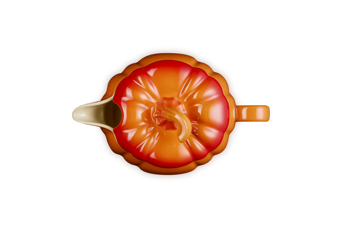 Top view of Le Creuset Halloween Pumpkin Gravy Boat in volcanic orange with a pumpkin-shaped lid and handle.