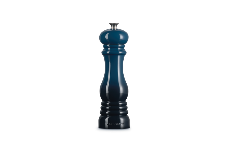 Le Creuset Salt Mill Nuit in glossy dark blue with silver top, shown upright on white background.