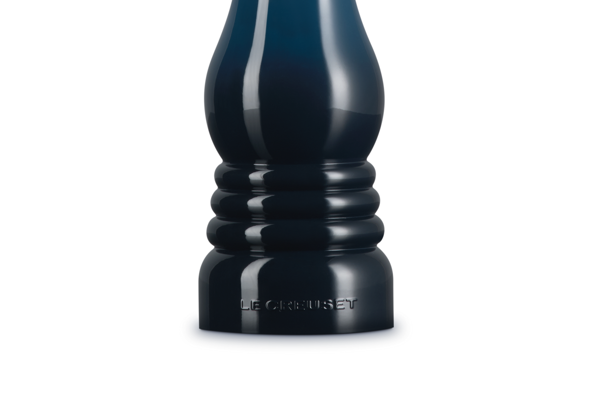 Le Creuset Salt Mill in glossy deep blue with embossed logo on the base, front view.