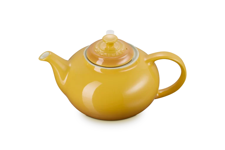 Le Creuset Stoneware Classic Teapot with Infuser in yellow nectar, side view on white background