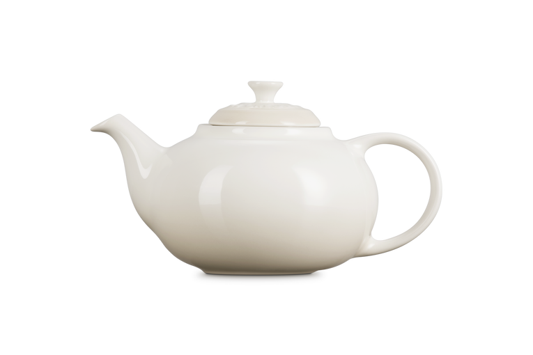 Le Creuset Stoneware Classic Teapot with Infuser in smooth meringue cream, side view on white background