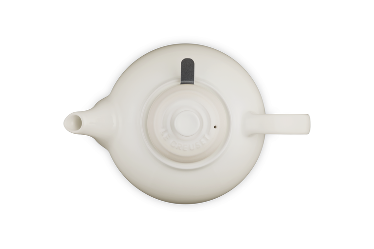 Top view of a meringue-colored Le Creuset Stoneware Classic Teapot with Infuser showing spout, handle, and lid.