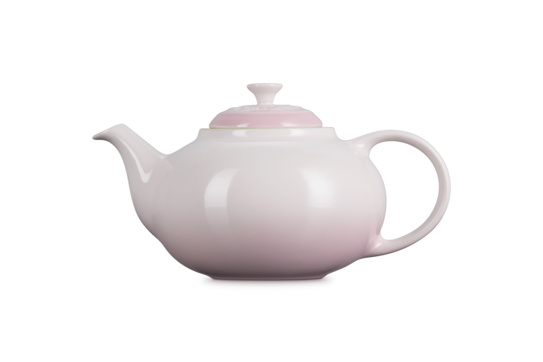 Le Creuset Stoneware Classic Teapot with Infuser in shell pink, side view on white background