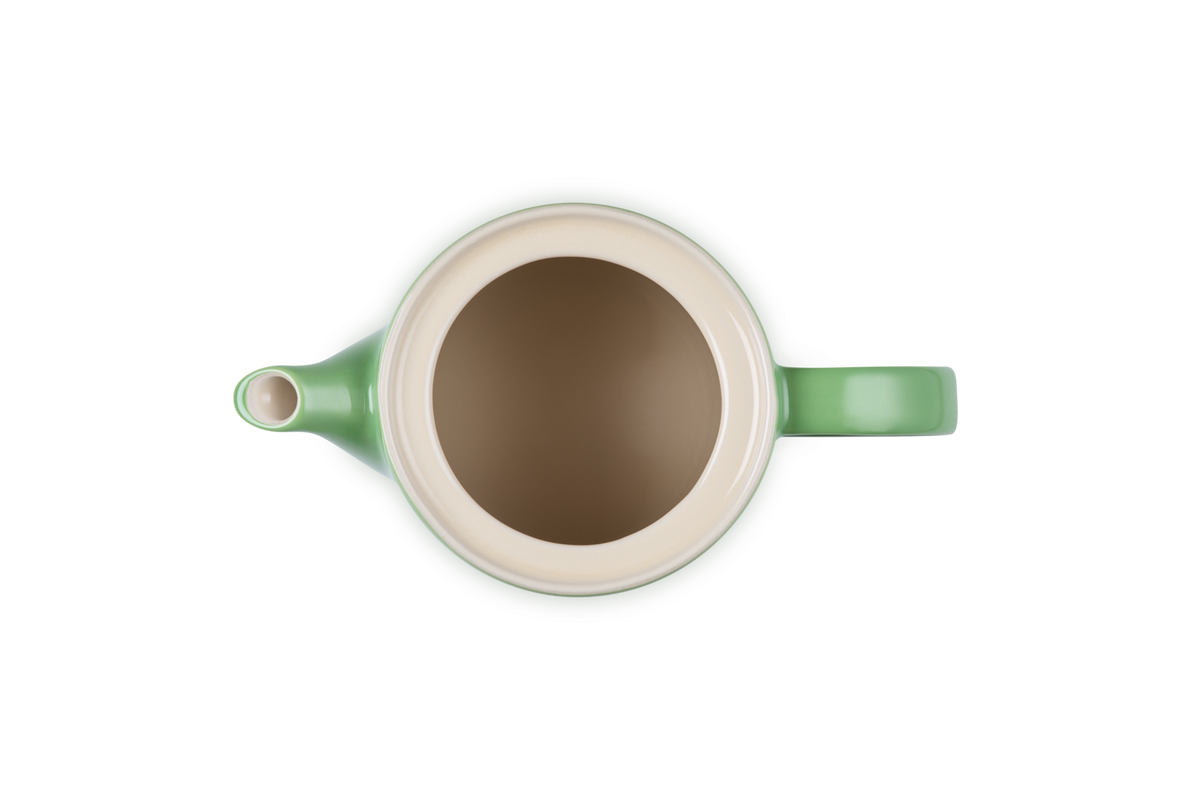 Top-down view of a green Le Creuset 1.3L Grand Teapot showing the open lid and interior.
