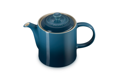 Le Creuset 1.3L Grand Teapot in deep teal with lid, shown from a slightly elevated angle on a white background.