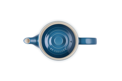 Top view of a deep teal Le Creuset 1.3L Grand Teapot showing the lid and spout details.