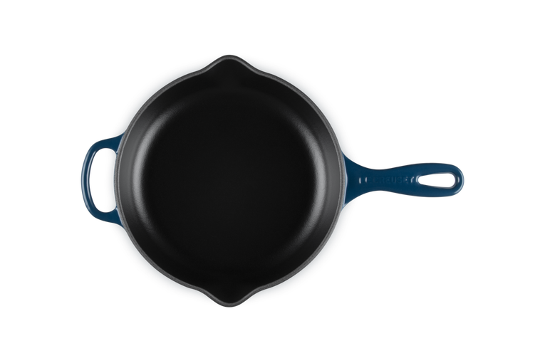 Le Creuset 23cm Signature round skillet in Nuit blue, top view showing interior and handles