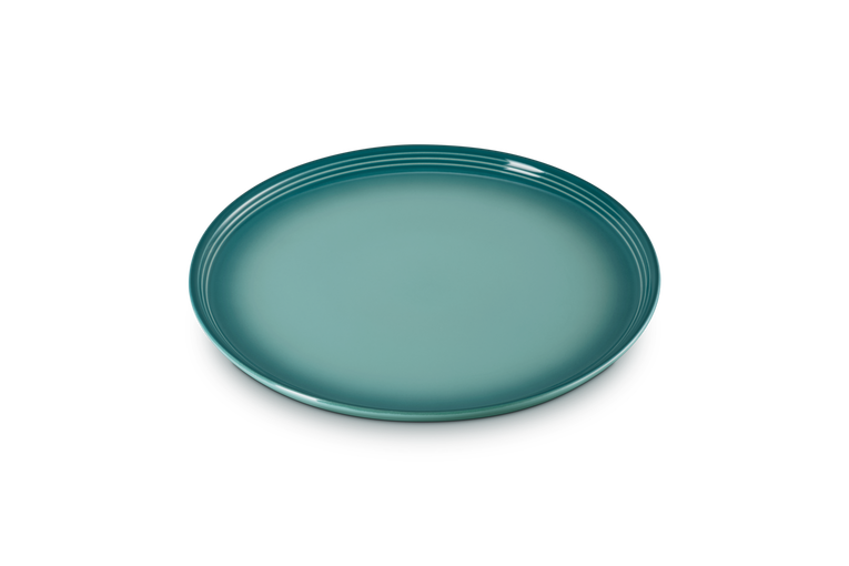 Le Creuset Coupe Range dinner plate in Blue Riviera, shown flat with a glossy finish and ridged rim.