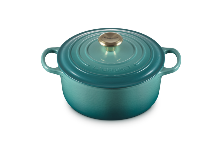 Le Creuset 28cm round casserole in Blue Riviera with lid and gold-tone knob, front angle view.