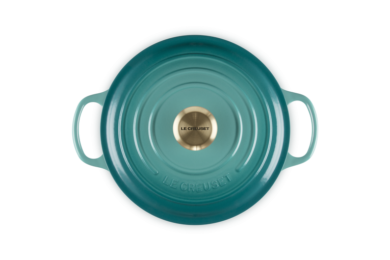 Le Creuset 28cm round casserole in Blue Riviera, top view showing lid with brass knob and handles.