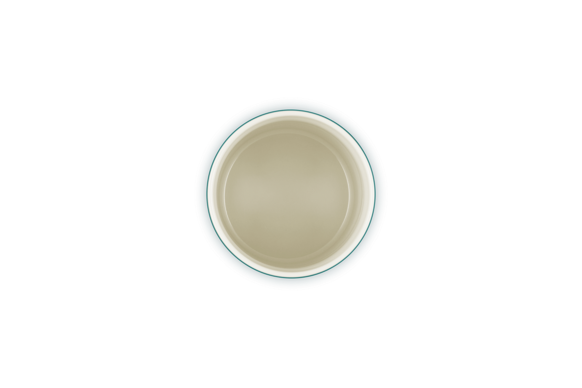 Top-down view of an empty Le Creuset Stoneware Storage Jar in Blue Riviera with a cream interior.