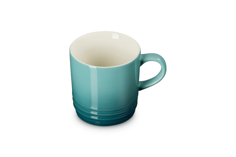 Le Creuset Cappuccino Mug 200ml in Blue Riviera, shown from a slight side angle with handle visible.
