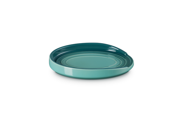 Le Creuset Oval Spoon Rest in Blue Riviera with a glossy finish and raised edges.