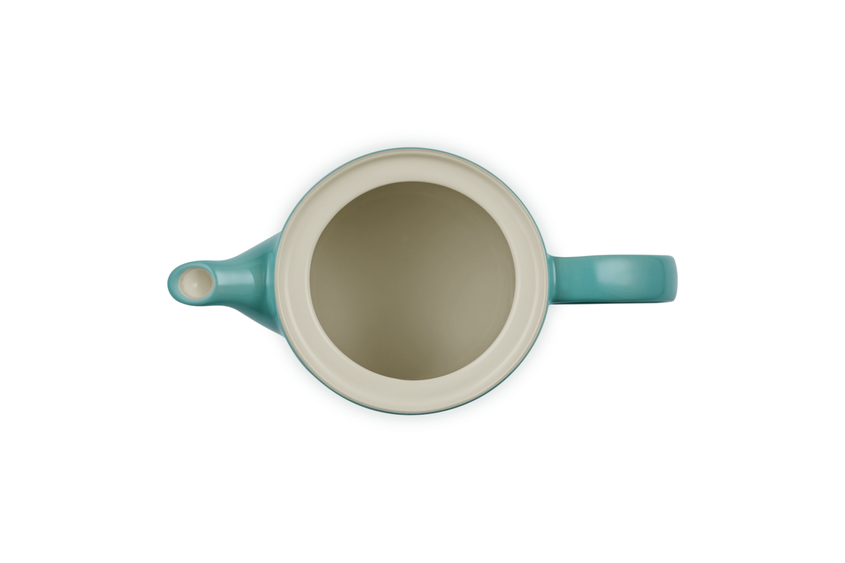 Top view of a blue Riviera Le Creuset 1.3L Grand Teapot showing the empty interior and spout.