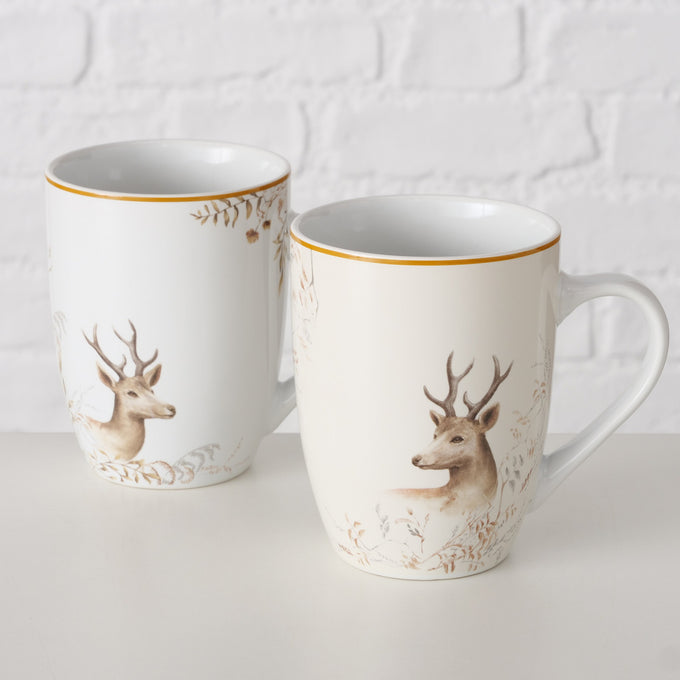 White porcelain mug with festive deer design, 330ml, dishwasher-safe, 2 assorted styles, sold singly – Keans Claremorris
