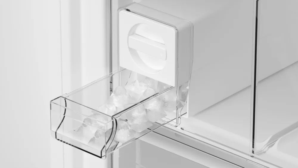 Close-up of Siemens IQ500 freezer's removable transparent ice cube tray filled with ice cubes inside the freezer compartment.