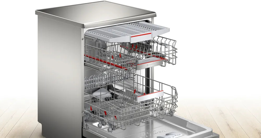 Bosch Series 6 60cm brushed steel dishwasher with open door showing three adjustable racks and cutlery tray.