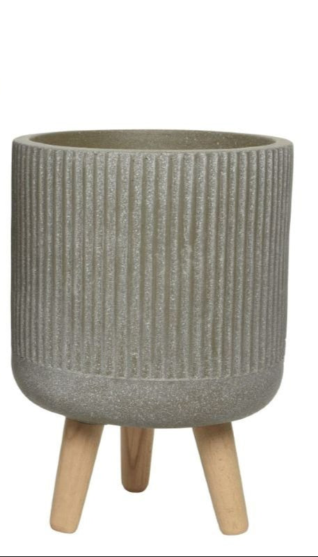 Logan Handmade 3-Leg Planter Small in taupe fibre clay with vertical stripes and wooden legs, front view.