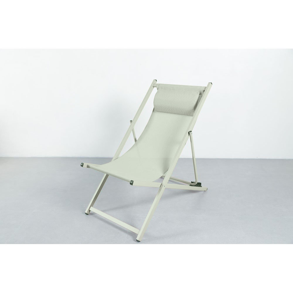 Green 4-position beach chair with pillow, Textilene fabric and powder-coated frame, angled view.