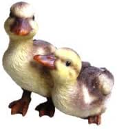 Playful Ducklings resin duo with lifelike features, 12cm long, indoor/outdoor decor by Keans Claremorris.
