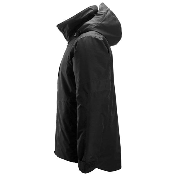 Snickers Insulated Jacket in black shown from the side with hood up and zipped collar.